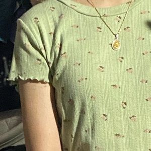 Green Ruffle Hem tee with baby pink flowers